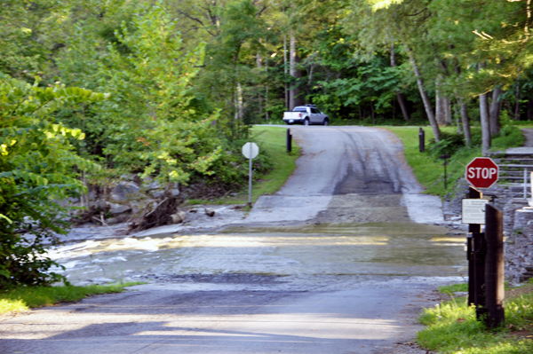 water from the falls runs right over the road